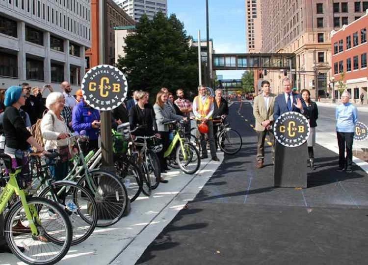 Saint Paul Mayor Coleman cutting the ribbon on Phase 1 of the Capital City Bikeway.