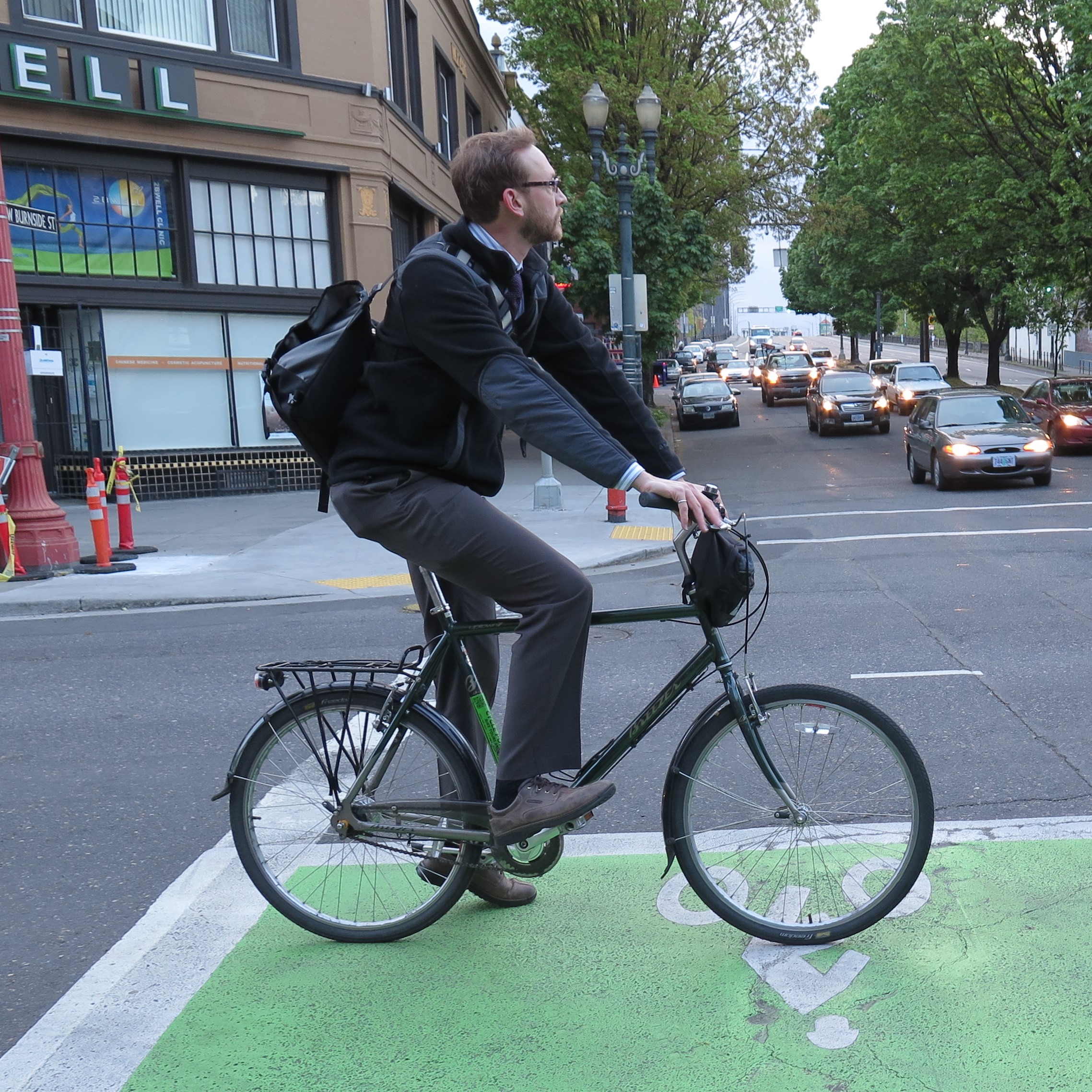 Jeremy Chrzan waits in a two-stage turn box at a stoplight while riding his bike.