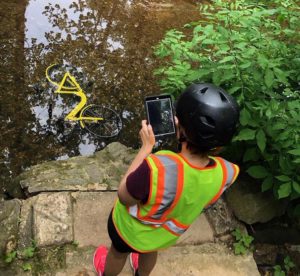 A Toole Design intern conducts a census of discarded bikeshare hardware.