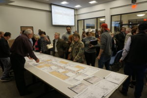 People in Denison TX check out some concept designs at a public meeting.