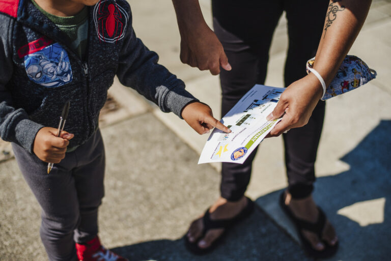 A child completes a scavenger hunt activity during the San Pablo SR2S Plan demonstration project.