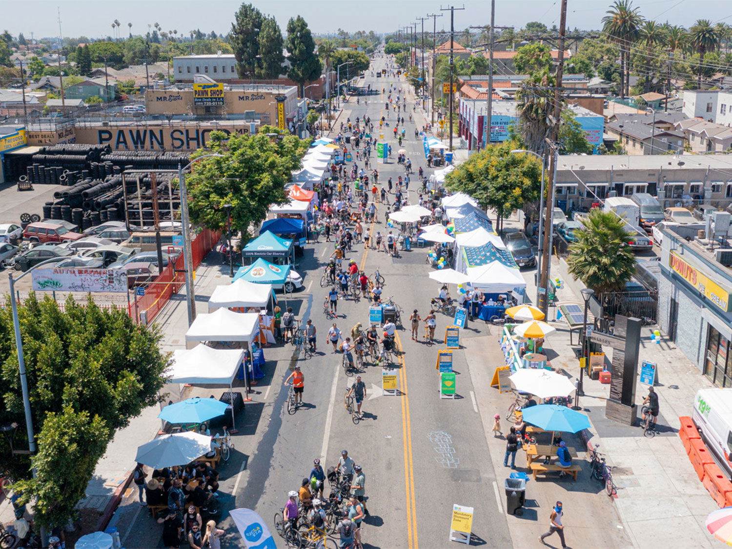 Overhead drone image of CicLAvia South LA activation booth area where participants gathered to learn more about open streets.
