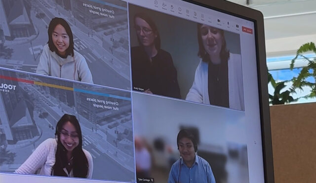 Interns meet to discuss their group project.